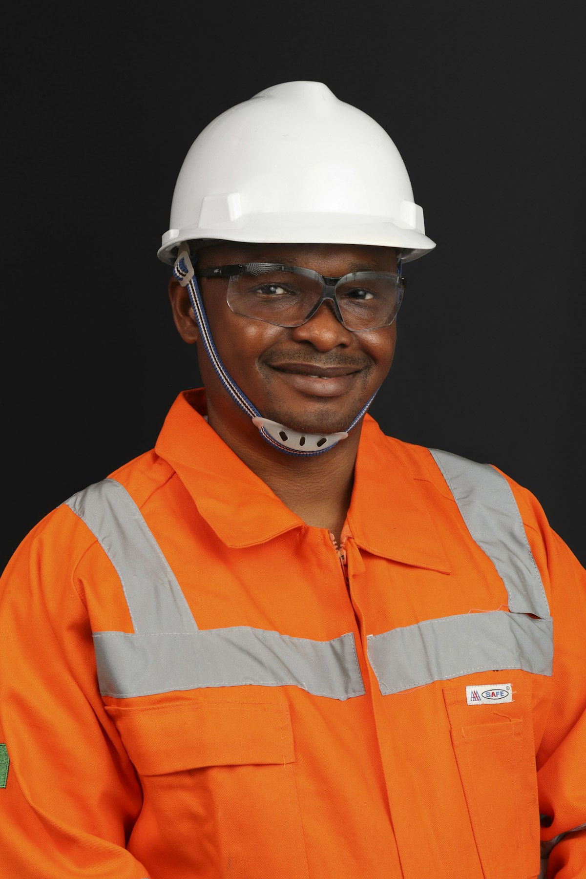 Site worker in hard hat and full safety equipment