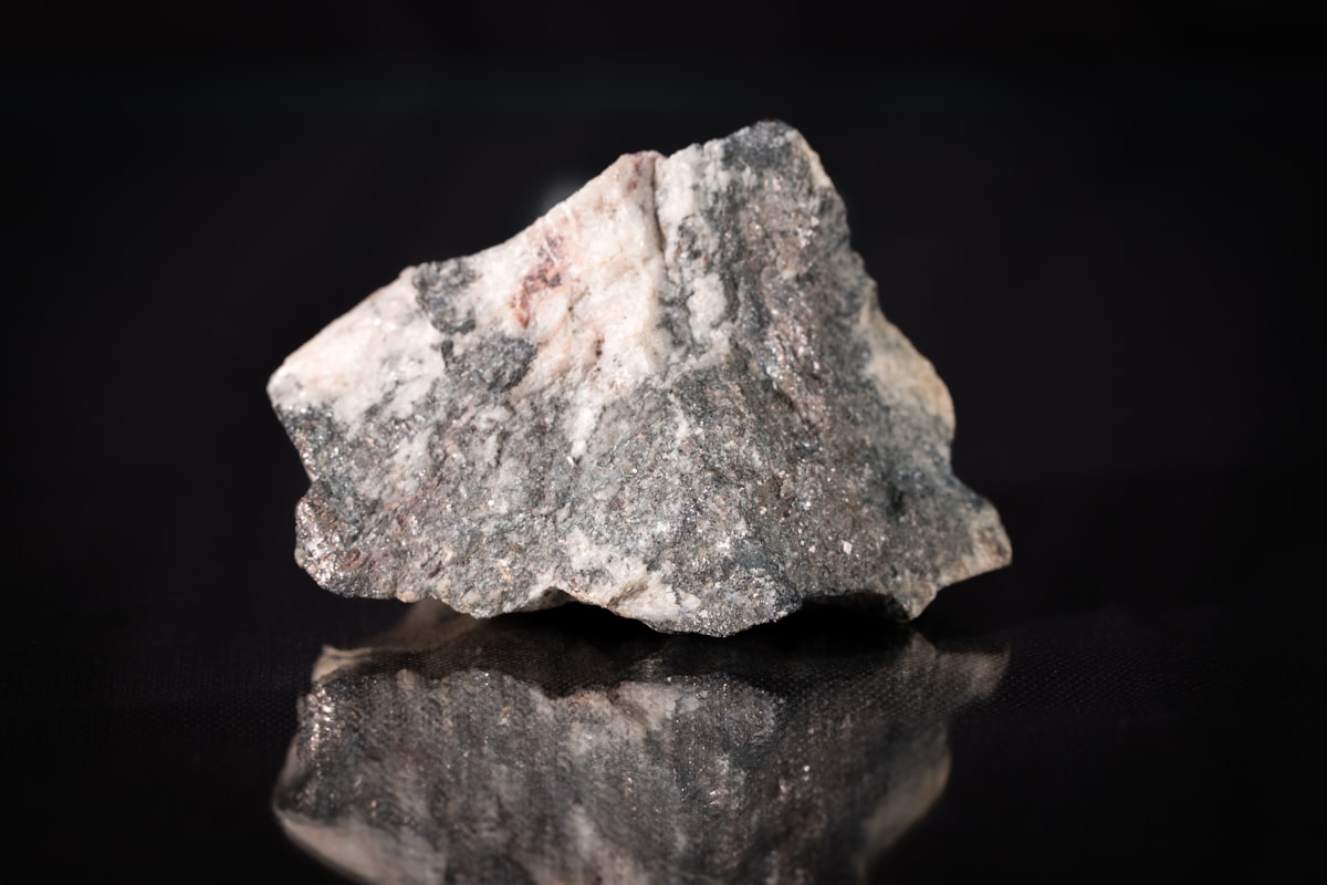 Rock fragment showing quartz and iron staining