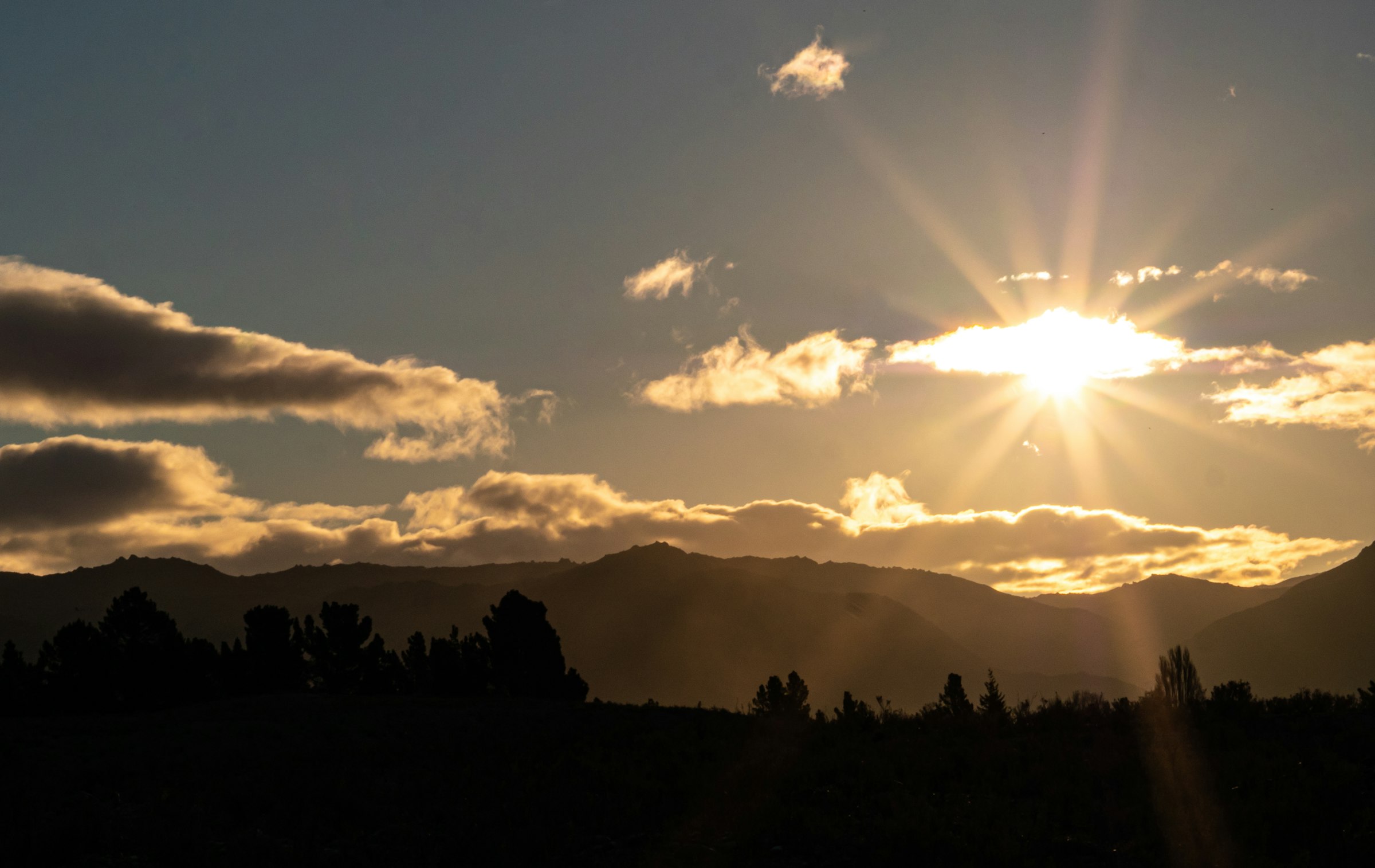 Sunset over the mountain range at the project area